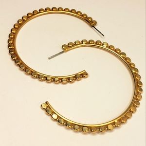 Gold tone spotted hoop earrings
